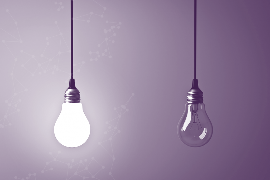 An image of two light bulbs with one alight representing making a move
